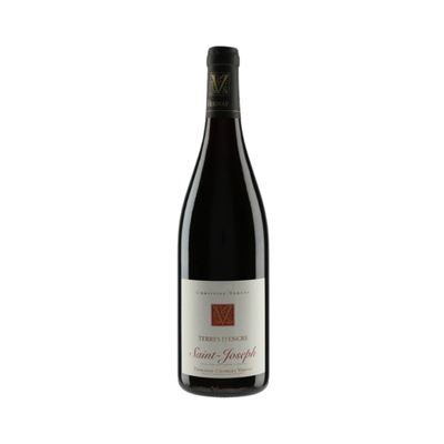 Bottle of Domaine Georges Vernay Saint-Joseph Terres d’Encre 2023 with granite hillside vineyard in the background