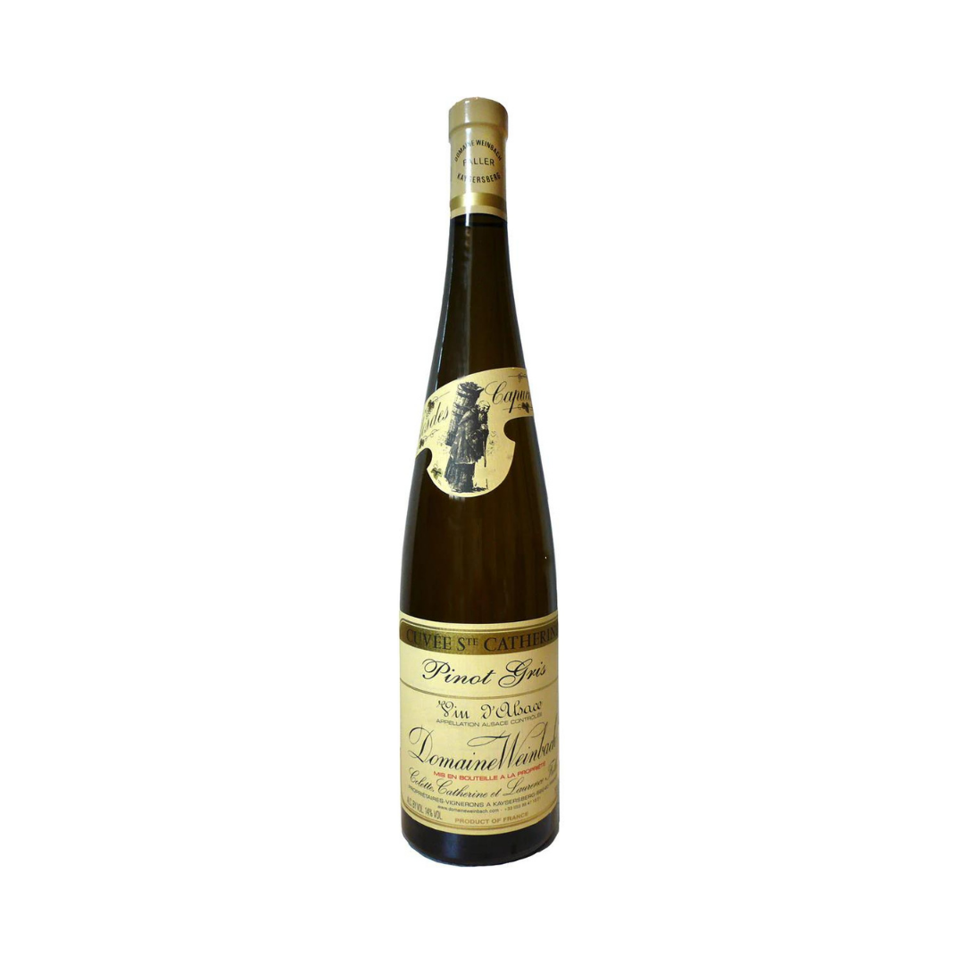 Bottle of Domaine Weinbach Pinot Gris Cuvée Ste. Catherine 2020 – biodynamic dry white wine from Alsace with smoky tension and exotic precision. 17+ pts Jancis Robinson.


